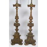 PAIR OF ITALIAN CARVED PRICKET STICKS 18th c., fitted as lamps, pricket measures 31”h Paint loss and