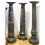 A NEAR PAIR OF 19TH CENTURY DARK GREEN MARBLE COLUMNS, each with a circular stand above twist and