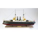 A LARGE SCALE MODEL OF THE JAPANESE BATTLESHIP MIKASA, scratch built to museum quality, revealing