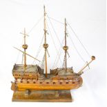 A SCRATCH BUILT MODEL OF A 16TH CENTURY SPANISH GALLEON, circa mid-20th century, made from oak