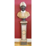 A MARBLE BUST ON AN ANGLED COLUMN, depicting a Moorish gentleman with moustache and turban, raised