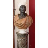 A MARBLE BUST ON A CIRCULAR GREEN MARBLE COLUMN, depicting a Moorish gentleman wearing a turban, H