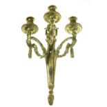 A FRENCH 19TH CENTURY GILT METAL EMPIRE STYLE THREE BRANCH APPLIQUE, decorated with swags and a rams