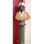 A MARBLE BUST ON A GREEN MARBLE COLUMN, depicting a Moorish boy wearing a turban, raised on a