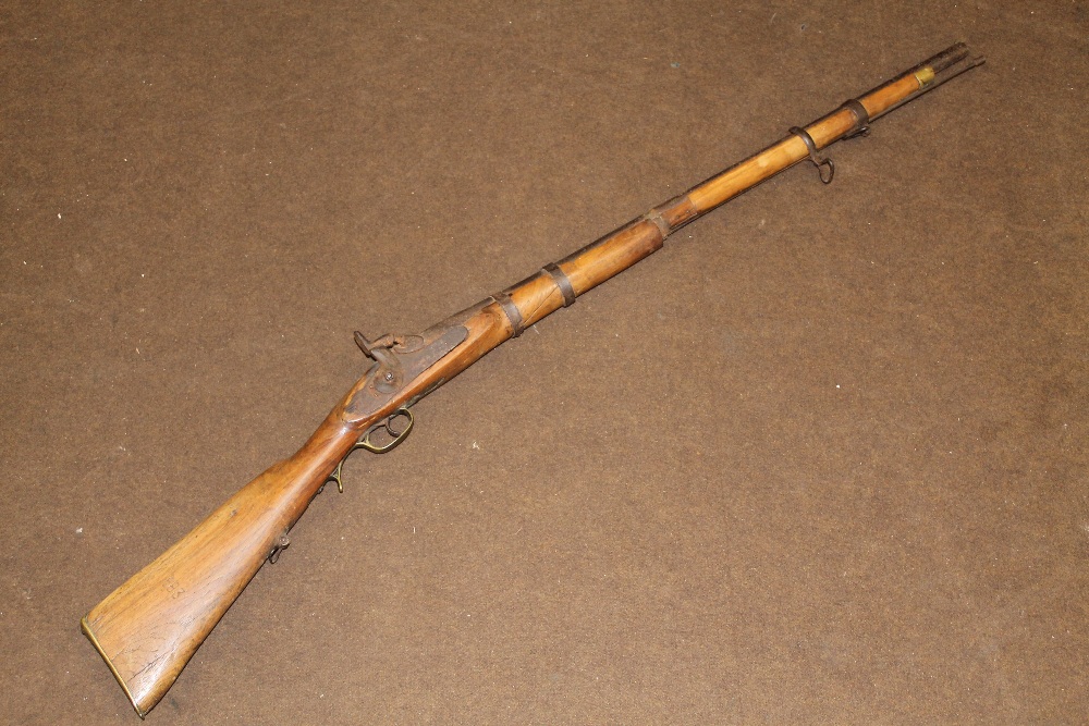 A 19TH CENTURY MUZZLE LOADING PERCUSSION FIRE RIFLE,  butt with brass end plate, the woodwork