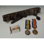 A WWI VICTORY AND BWM PAIR, named to '151505 Gnr D. Passmore R.A.' along with a belt of buttons