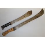 TWO MID 20TH CENTURY MACHETE, the longer, L 70 cm with wooden grip and curved blade with three