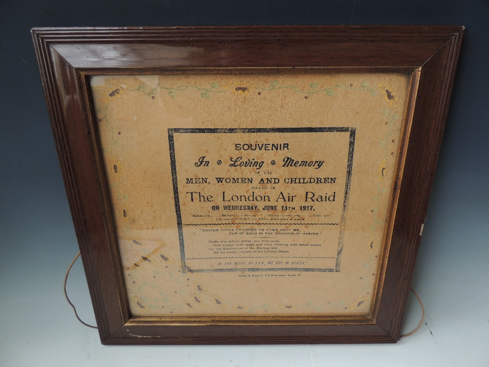 A FRAMED AND GLAZED PRINTED SOUVENIR POSTER TO COMMEMORATE THE LONDON AIR RAID 1917, exactly dated