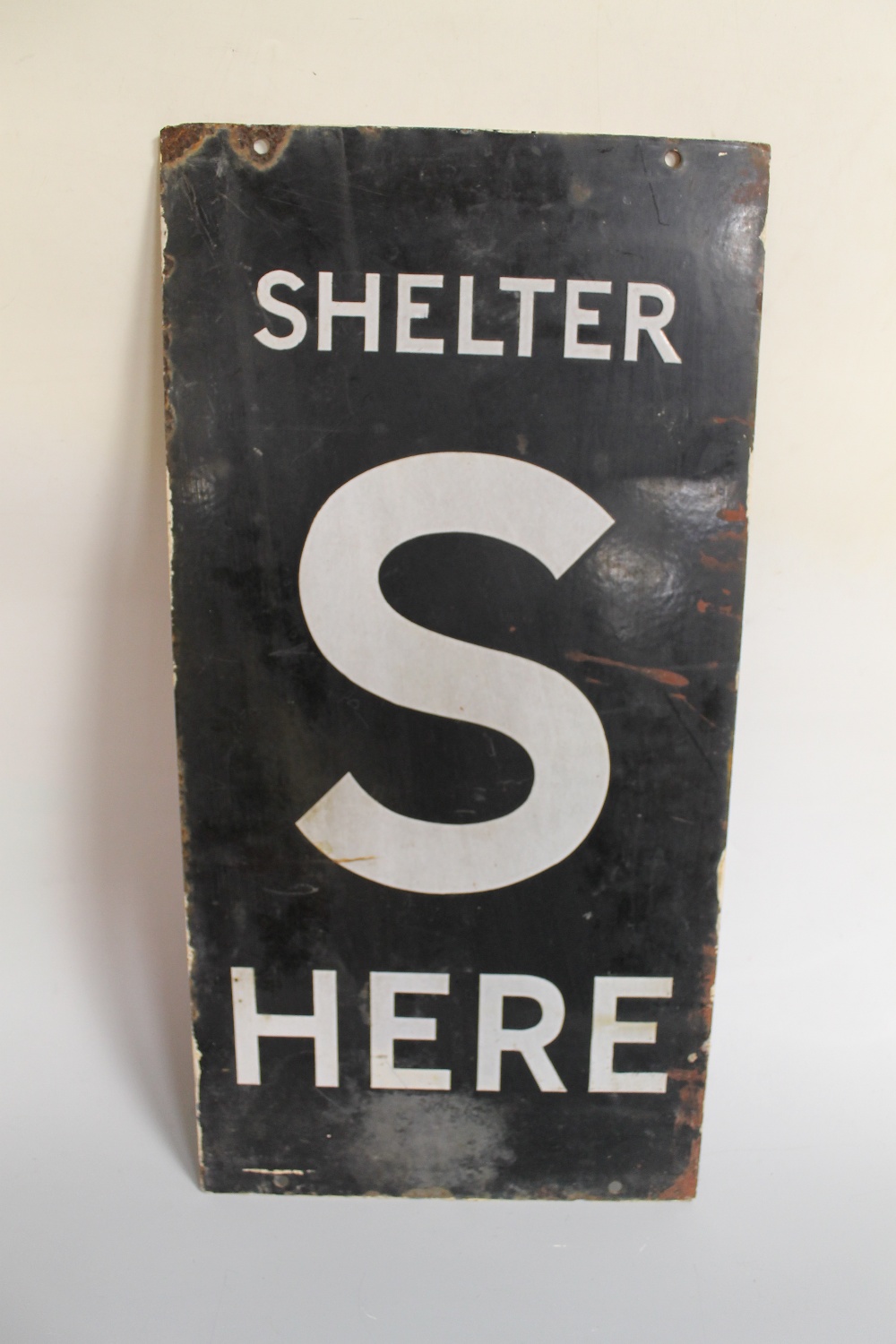 A WWII DOUBLE SIDED ENAMEL AIR RAID SHELTER SIGN, inscribed 'S Shelter Here' in black and white,