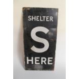 A WWII DOUBLE SIDED ENAMEL AIR RAID SHELTER SIGN, inscribed 'S Shelter Here' in black and white,