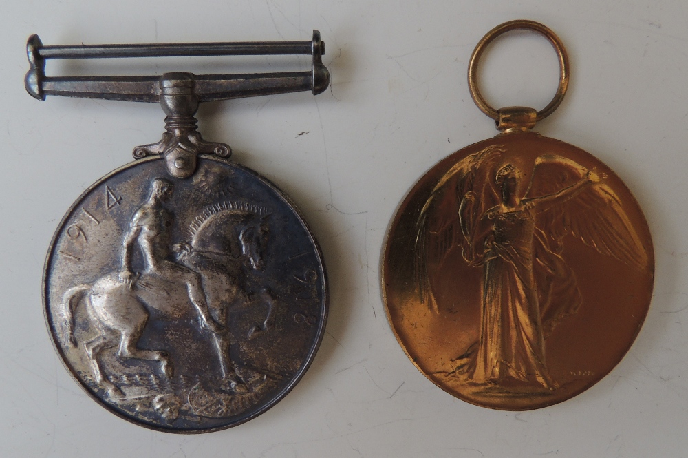 A WWI CASUALTY MEDAL PAIR, British War and Victory, named '32533 Pte F. Buller Lan. Fus.', in