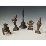 A SMALL GROUP OF INDIAN CAST BRONZE/BRASS FIGURES OF DEITIES, together with a bell (5) Buyers -