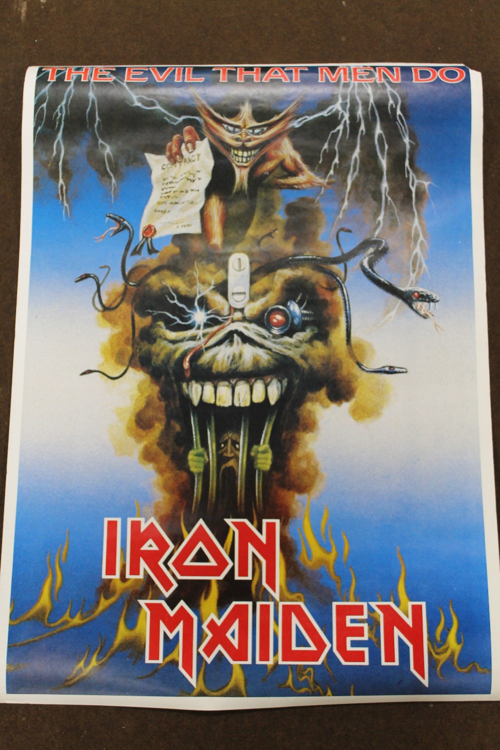 AN IRON MAIDEN 'THE EVIL THAT MEN DO' POSTER, A/F Buyers - for shipping pricing on this lot, visit