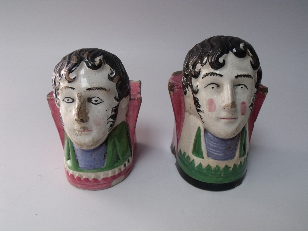 A MATCHED PAIR OF 19TH CENTURY SASH WINDOW RESTS, modelled as a gentleman's head and shoulders,