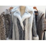 A STYLISH SILVER FOX VINTAGE FAUX FUR COAT, with contrasting woollen sleeves and panels, fully