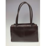 A GENUINE LADIES RADLEY LEATHER HANDBAG, the main body in a rich dark brown, contrasting striped