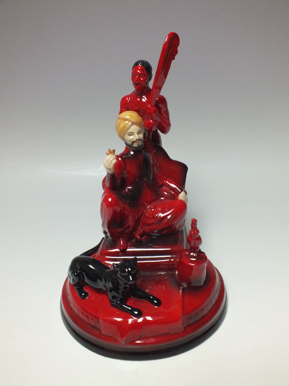 A PEGGY DAVIES LIMITED EDITION FLAMBE - RUBY FUSION FIGURE 'THE SULTAN', this highly detailed figure