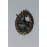 A WWII GERMAN COASTAL ARTILLERY BADGE, made by FFL 43, with fixing pin and catch present Buyers -