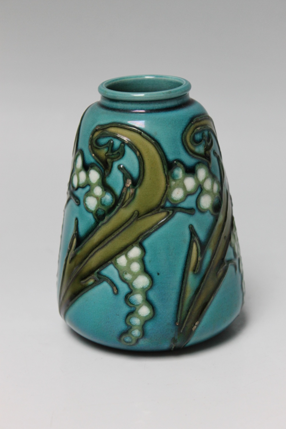 A MINTON LTD SECESSIONIST VASE No 5, turquoise ground with tubelined decoration, H 10.5 cm