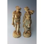 A LARGE PAIR OF VICTORIAN FIGURES, modelled as a lady and gentleman in traditional attire, blush