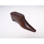 AN EARLY VICTORIAN SNUFF BOX IN THE FORM OF A BOOT, with a sliding lid, pin head decoration