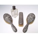 TWO HALLMARKED SILVER BACKED BRUSHES - BIRMINGHAM 1925, maker's mark 'B & Co' both with embossed