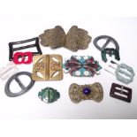A COLLECTION OF VINTAGE DRESS CLIPS AND BUCKLES, comprising a filigree clip, two enamel clips, and a