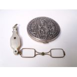 A CONTINENTAL SILVER AND WHITE METAL LADIES POWDER COMPACT, embossed and figural decoration to the