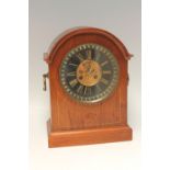 A LATE 19/EARLY 20TH CENTURY MAHOGANY CASED MANTEL CLOCK, the outer dial with gilt Roman numerals,