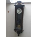 A VIENNA WALLCLOCK, the enamel dial with Roman numerals, glazed case, twin brass weights and