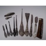 A SELECTION OF SILVER HANDLED VANITY / DRESSING TABLE ITEMS ETC., various dates and makers, to