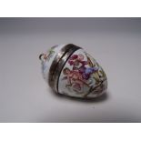 A CONTINENTAL ENAMEL EGG SHAPED PENDANT VINAIGRETTE, painted floral and figural decoration on a