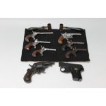 A COLLECTION OF SIX OBSOLETE BELGIAN PIN FIRE MUFF PISTOLS AND A BELGIAN BULLDOG POCKET REVOLVER,