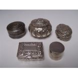 FIVE SILVER AND WHITE METAL TRINKET / PILL BOXES, to include an Egyptian silver oval pill box, the