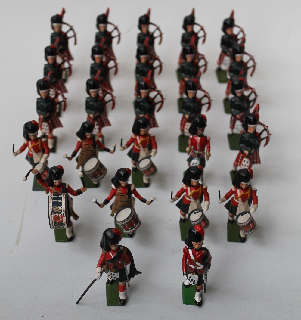 A COLLECTION OF BRITAINS METAL SOLDIERS, depicting the Black Watch marching band (approx 26)