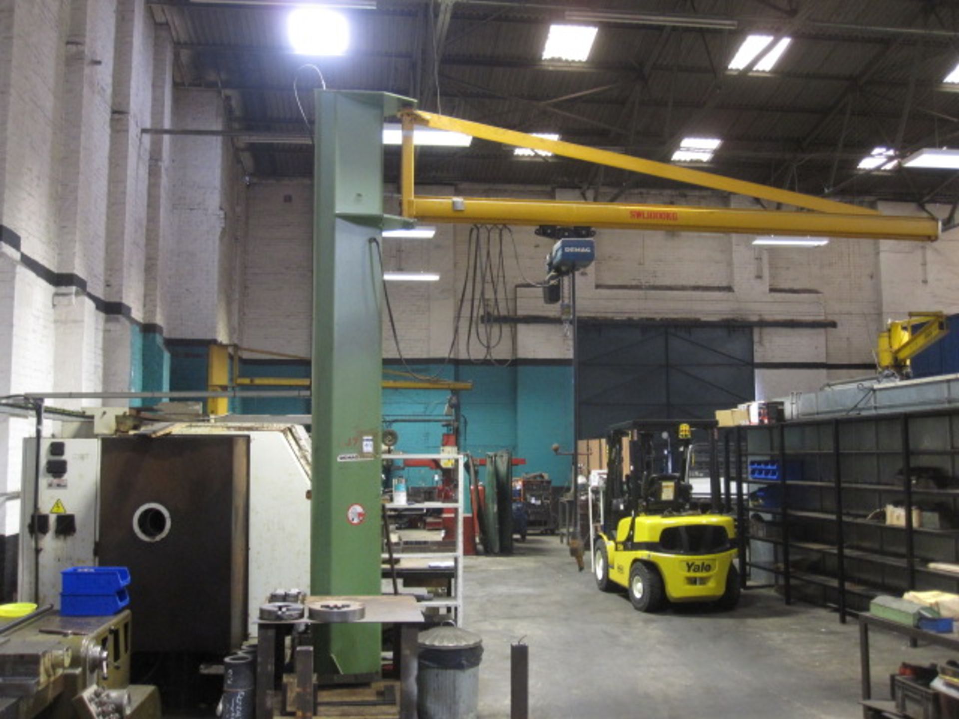 DEMAG 1000kg SWL swing jib crane with DEMAG pendant controlled electric chain block. Note: Full Risk