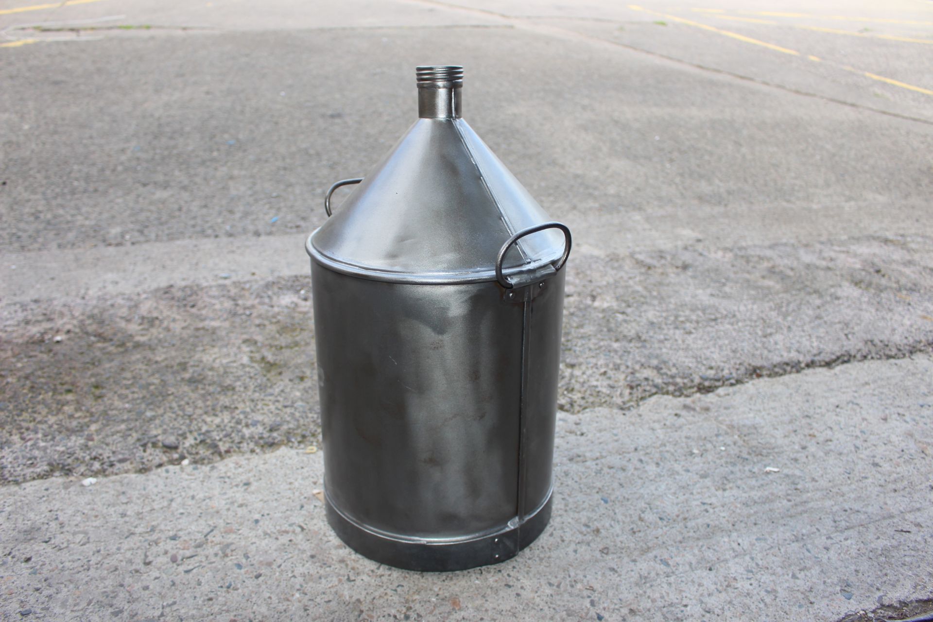 Large polished oil can