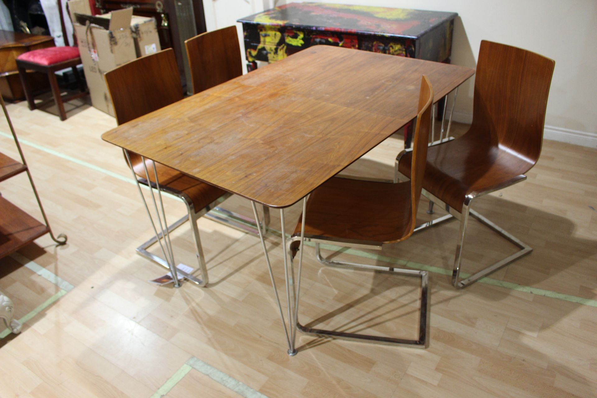 vintage dinner table with hair pin chrome leg and four chairs