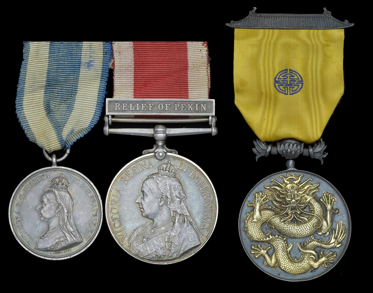 A rare Boxer Rebellion Military Order of the Dragon group of three awarded to Major F. V.