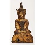 Kl. Buddha, Sukhothai (Thailand) wohl 14. Jh.Bronze, vergoldet. Im Lotussitz, eine Hand in d.