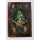 Miniatur "Göttin Tara", Tibet 18. Jh.Auf Horn gemalt. Hochrechteckiges Bildfeld m. grüner, auf Lotus