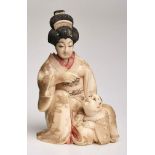 Okimono "Geisha mit Kind", Japan um 1900.Elfenbein, vollrd. geschnitzt u. partiell gefärbt.