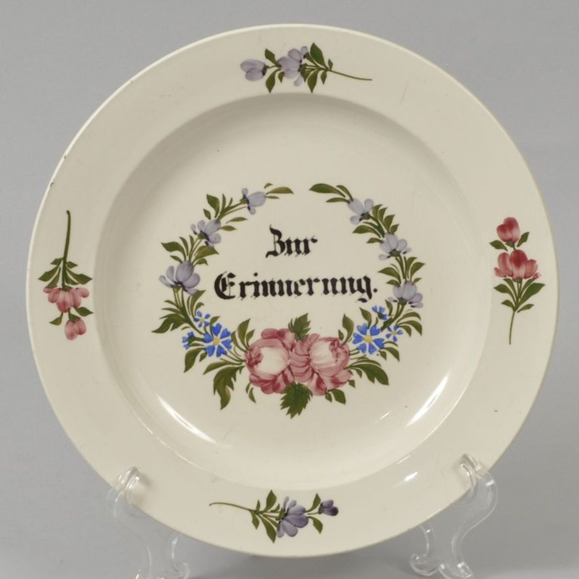 Steingutteller, Karl August Zschau, 1. H. 19. Jh.Polychrome Aufglasurmalerei mit Blumenranken.