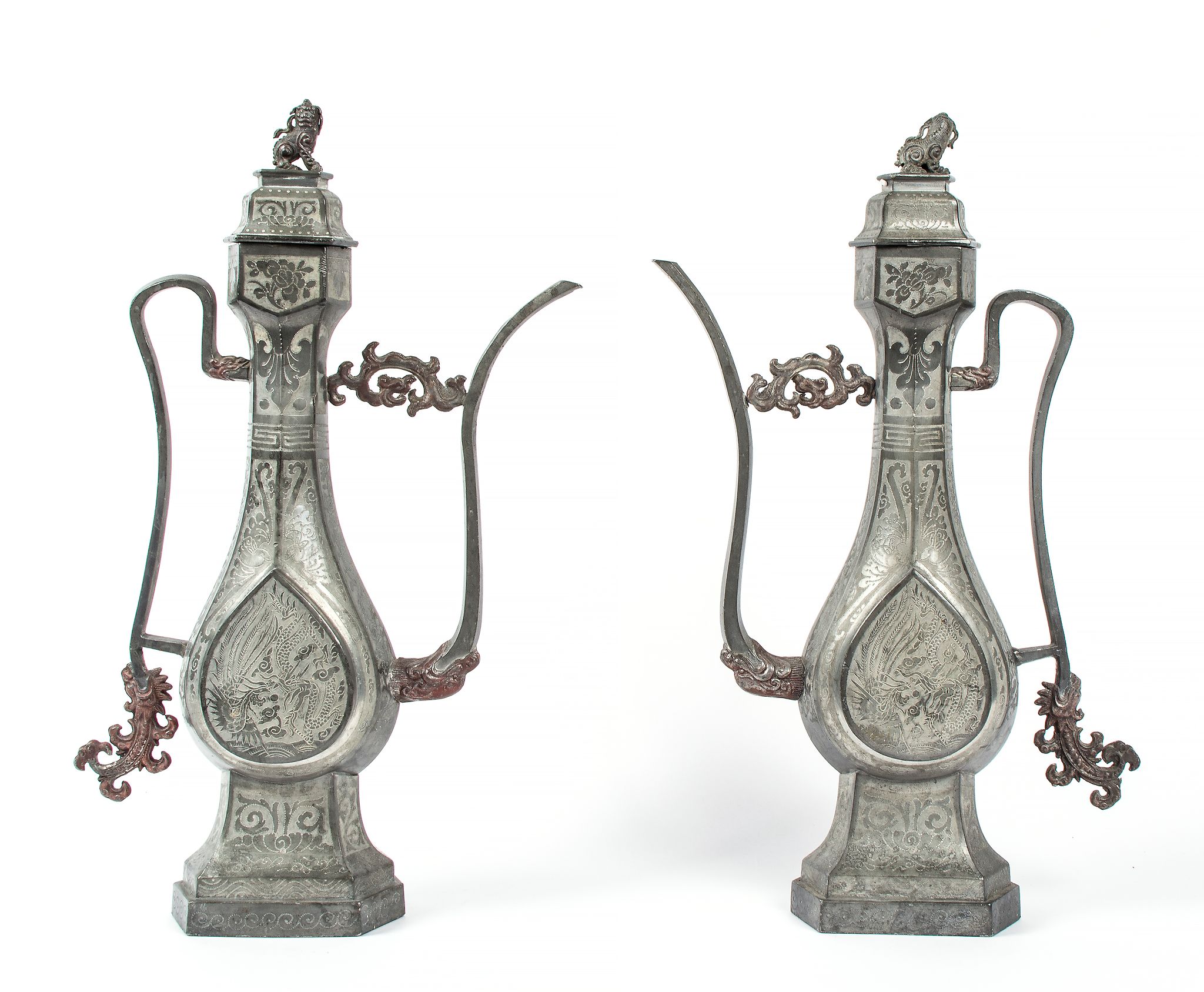 A pair of pewter ewers, 19th century , of Middle Eastern metalwork form with...  A pair of pewter