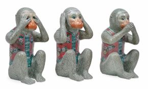 A group of three modern Chinese porcelain models of monkeys  A group of three modern Chinese