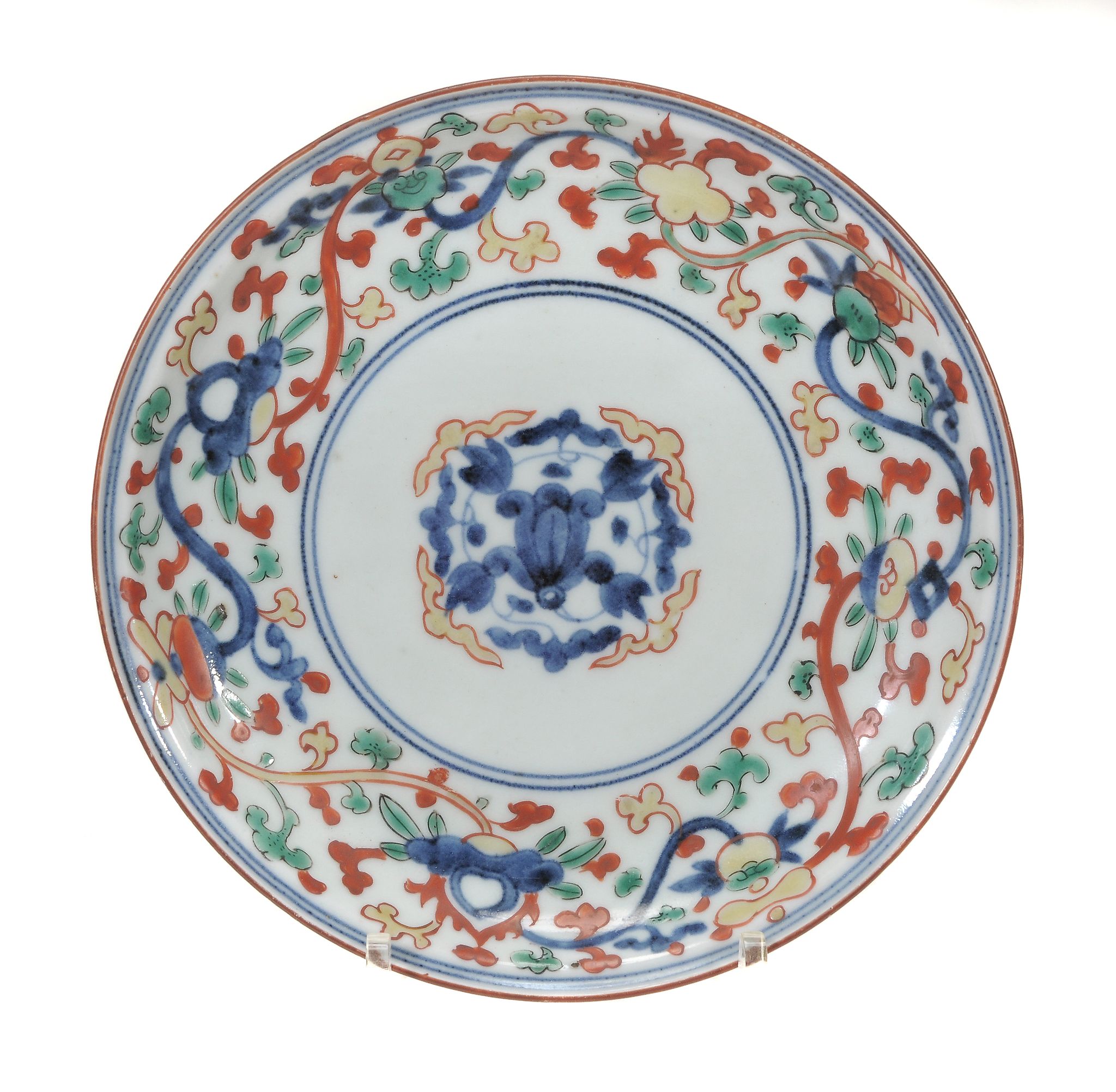 An Arita saucer dish, 18th century, of typical shallow circular form...  An Arita saucer dish,