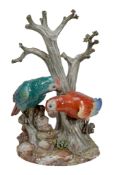 A Meissen group of two parrots perched on a tree-stump, late 19th century  A Meissen (outside