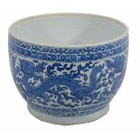 A Chinese blue and white jardiniere decorated with dragons amid vaporous clouds  A Chinese blue