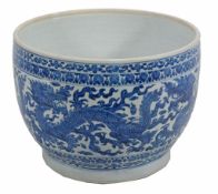 A Chinese blue and white jardiniere decorated with dragons amid vaporous clouds  A Chinese blue