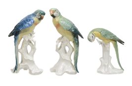 Three various modern German porcelain models of parrots, 25cm high and smaller  Three various modern